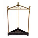 AN ANTIQUE BRASS STICK STAND with a cast iron base, 42cm wide x 20.5cm deep x 62cm high Condition: