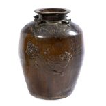 A CHINESE BROWN GLAZED OVOID JAR decorated with a dragon, 48cm diameter x 65cm high Condition: marks