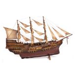 A WOODEN MODEL OF A THREE MASTED GALLEON 128cm wide x 23cm deep x 78cm high Condition: some chips,