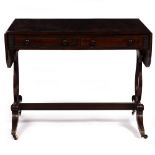 A REGENCY MAHOGANY AND EBONY INLAID SOFA TABLE with drop ends, two drawers with turned ebony