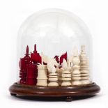 A 19TH CENTURY TURNED IVORY CHESS SET the kings 10.5cm high together with a glass display dome,