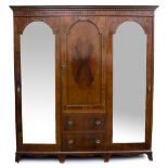AN EDWARDIAN MAHOGANY TRIPLE WARDROBE with satinwood inlaid decoration, a central panelled door