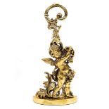 A 19TH CENTURY BRASS DOOR PORTER in the form of a winged cherub with a looping handle by Peerage