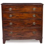 A 19TH CENTURY BOW FRONTED MAHOGANY CHEST OF FOUR LONG GRADUATED DRAWERS standing on bracket feet,
