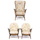 A PAIR OF ERCOL SPINDLE BACK ARMCHAIRS together with a further high backed Ercol armchair, the