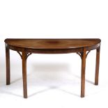 A 19TH CENTURY MAHOGANY DEMI-LUNE TABLE with square legs, 144.5cm wide x 71.5cm deep x 71cm high