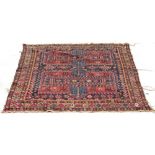 A PERSIAN POLYCHROME RUG with geometric decoration, 113cm x 115cm Condition: extensive wear and