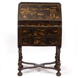 AN ANTIQUE CHINOISERIE SMALL BUREAU with fall front enclosing a fitted interior over three drawers