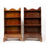 TWO SIMILAR REGENCY STYLE MAHOGANY WATERFALL BOOKCASES with single drawers and standing on bracket