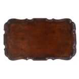 A GEORGE III MAHOGANY RECTANGULAR TRAY with serpentine piecrust edge, 62cm x 36cm