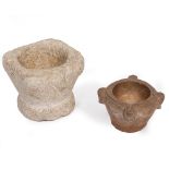 A CARVED ANTIQUE STONE MORTAR decorated with swags and one lug with pouring lip to the top, 16cm