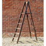 A DARK STAINED FIVE TREAD FOLDING WOODEN STEP LADDER 110cm x 54cm x 185cm when open