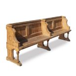 A VICTORIAN PINE FOUR SEATER PEW with moulded top rail, shaped ends and turned supports to the seat,