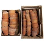 A QUANTITY OF OLD TERRACOTTA FLOWER POTS contained in two wooden crates, approximately 100 flower