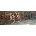 APPROXIMATELY TWELVE EARLY TO MID 19TH CENTURY CAST IRON STAIRCASE BANISTER RAIL SUPPORTS with