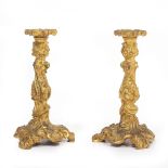 A PAIR OF ROCOCO STYLE ORMOLU CANDLESTICKS with removable drip pan, 26cm high