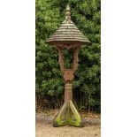A LARGE STAINED PINE GARDEN 'BELL STAND' with circular tapering shingle covered roof,