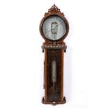 A LATE VICTORIAN OAK CASED 'JOSEPH DAVIS & CO' AMERICAN FORECAST BAROMETER with fretwork crest,