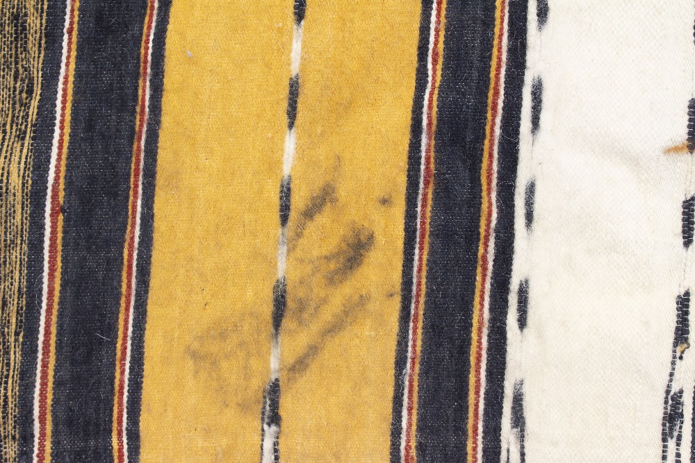 A CAMEL GROUND TRIBAL WOOLEN THROW with banded decoration and pompom tassels to the two ends, - Image 3 of 4