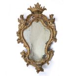 AN 18TH CENTURY, POSSIBLY ENGLISH, PIER GLASS of serpentine outline, the gilt gesso moulded frame