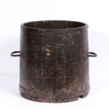 A 19TH CENTURY CYLINDRICAL IRON BOUND BUSHEL MEASURE with looping iron handles with embossed label