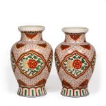 A PAIR OF CHINESE PORCELAIN BALUSTER VASES of flower decoration and flaring rims, 22cm diameter at