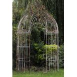 A PAINTED WIREWORK GARDEN ROTUNDA with domed top and scroll decoration, approximately 220cm diameter