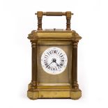 A LATE 19TH/EARLY 20TH CENTURY BRASS AMERICAN REPEATER CARRIAGE CLOCK, the architectural case with