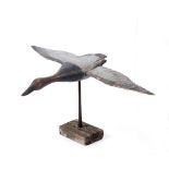 A CARVED PAINTED FOLK ART WOODEN SCULPTURE OF A FLYING DUCK with 72cm wing span, 44cm beak to tail x
