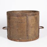 A VICTORIAN ELM AND IRON BOUND DRY MEASURE with looping handle and branded 'one bushel' and with