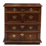 A 17TH CENTURY OAK CHEST of four long drawers with decorative mouldings to the drawer fronts, the
