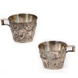 A PAIR OF WHITE METAL CUPS AFTER THE ANTIQUE stamped 925, each cup with a leaping bull decoration,