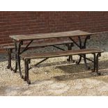 A RECTANGULAR TOPPED SLATTED GARDEN TABLE with black painted scrolling wrought iron supports to