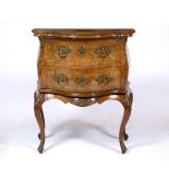 AN 18TH CENTURY STYLE WALNUT SERPENTINE TWO DRAWER COMMODE with gilt metal mounts and cabriole legs,