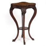 AN ANTIQUE POLLARD OAK ESTATE MADE TORCHIERE OR STAND with serpentine quartered top, oak leaf carved