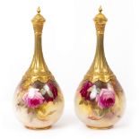 A PAIR OF WORCESTER GLOBULAR VASES AND COVERS with narrow necks decorated with roses by Sedgley,