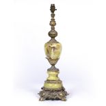 A CAST PARCEL GILT SPELTER AND FAUX ONYX TABLE LAMP with acanthus leaf moulded ornament and scroll