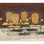 A SET OF FOUR EARLY 20TH CENTURY FRENCH WROUGHT IRON AND WICKER FOLDING ARMCHAIRS each 66cm wide x