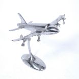 A CAST ALUMINIUM DESK TOP MODEL of a four engined aeroplane in flight, 72cm wide, the fusee large