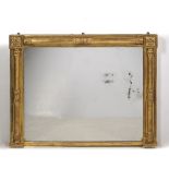 A REGENCY GILT FRAMED OVERMANTLE MIRROR with square floral motifs to the top two corners and