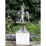 A TWO TIER LEAD FOUNTAIN with putti supports, shell cast bowls and dolphin base, approximately