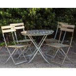 A SLATTED TEAK CIRCULAR CAFE TABLE with folding metal base, 76cm diameter x 70cm high together