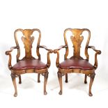 A PAIR OF EARLY 20TH CENTURY GEORGIAN STYLE WALNUT OPEN ARMCHAIRS with vase splats, scrolling