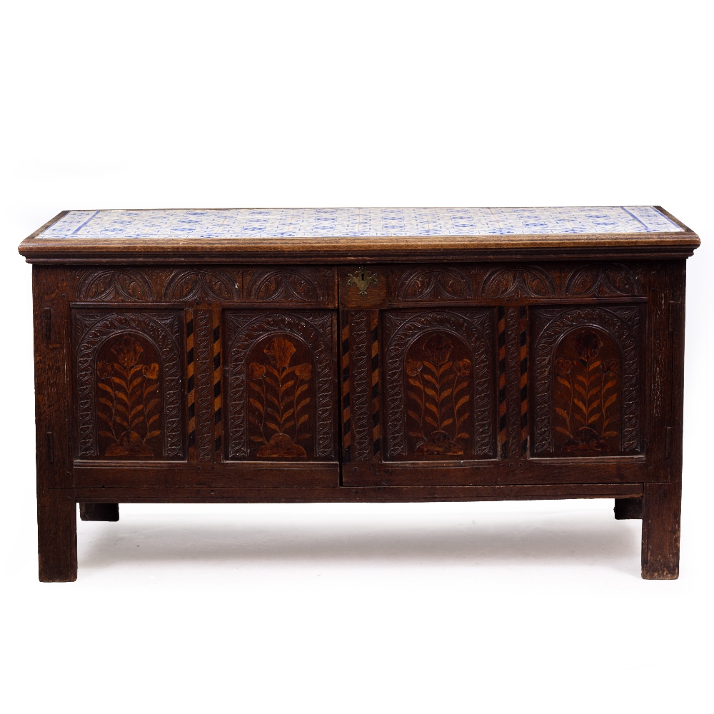 AN ANTIQUE OAK CUPBOARD converted from 17th Century and later parts with blue and white tile inset