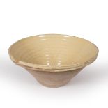 AN OLD TERRACOTTA CREAM GLAZED DAIRY BOWL 51cm diameter x 22cm high