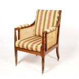 A 19TH CENTURY BERGERE ARMCHAIR with striped upholstered squab cushions, turned supports to the arms