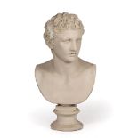 A CAST COMPOSITE BUST of a man after the Antique on a turned socle, 64cm high