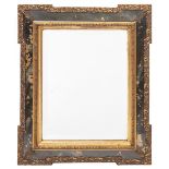 A DECORATIVE GILT FRAMED WALL MIRROR with outset corners, a central bevelled mirror plate flanked by