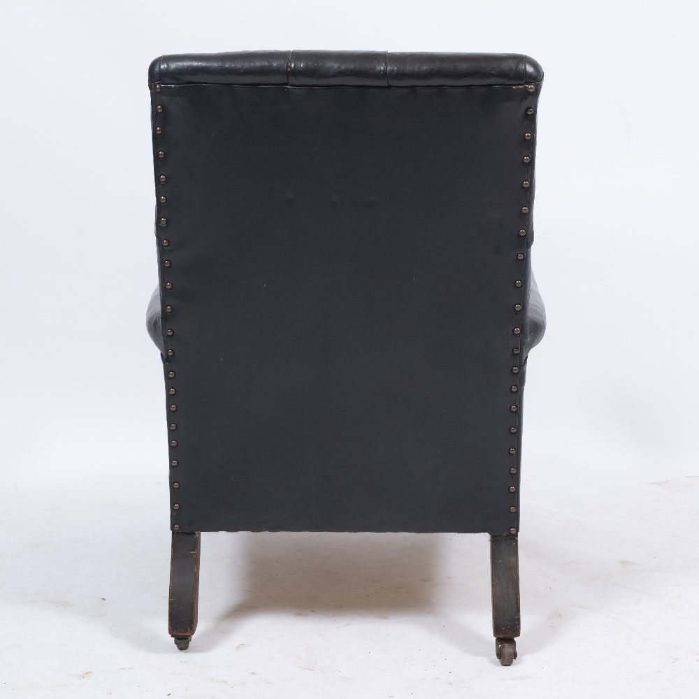 A VICTORIAN LEATHER UPHOLSTERED DEEP ARMCHAIR with button back, turned front legs and ceramic - Image 3 of 4