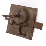 A LARGE, POSSIBLY 17TH CENTURY, IRON LOCK PLATE AND KEY the lock plate 37cm wide, the key 29.5cm